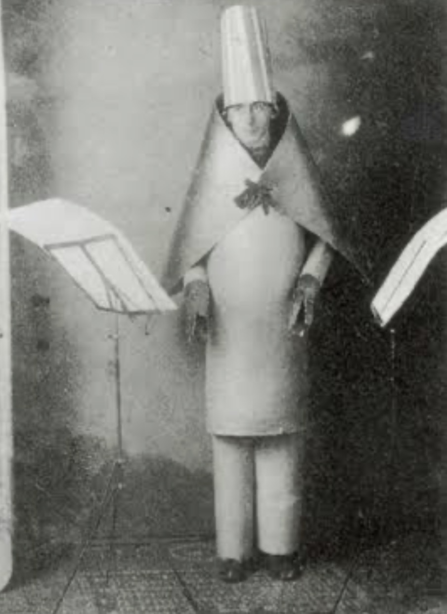 Hugo Ball performing in a sculptural costume at Cabaret Voltaire in Zürich in 1916